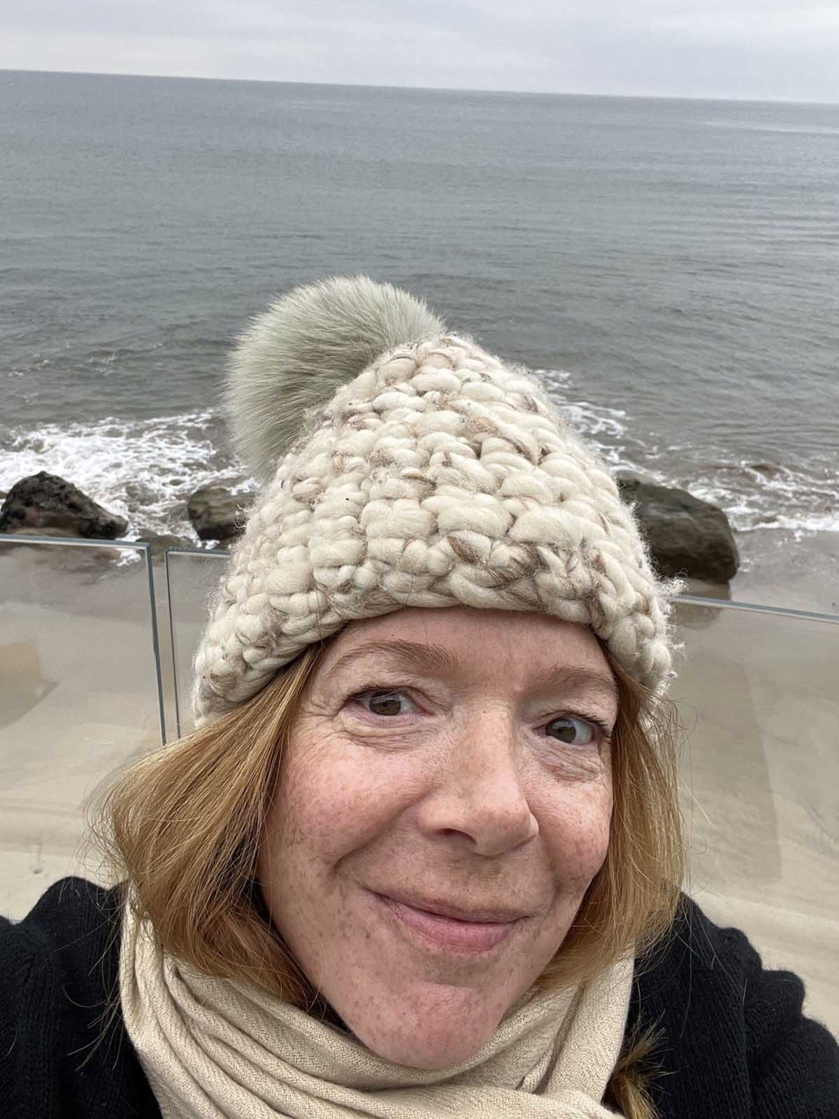 gentle smiling woman in stocking hat - frederika