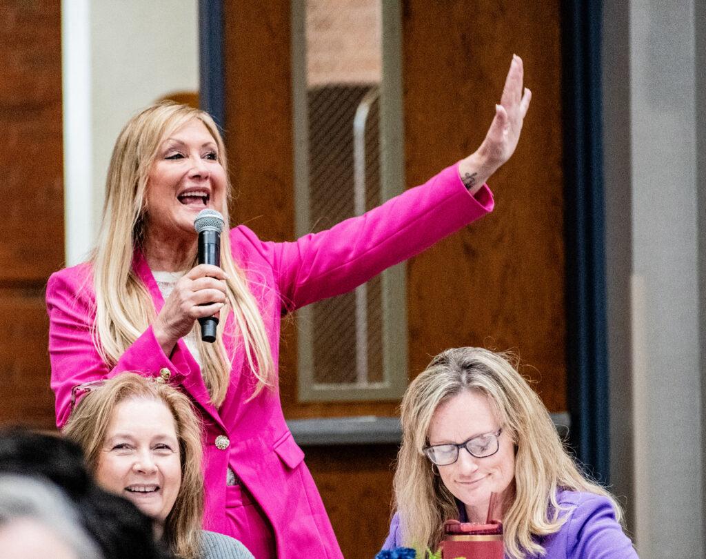 speaking pink jacket hand up cu web 1024x810 1